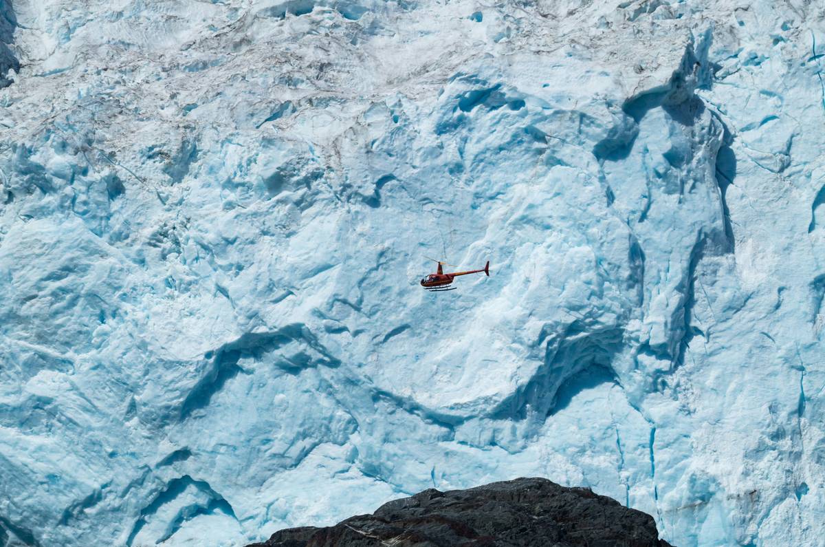 Climber extracting themselves using an ice piton system.