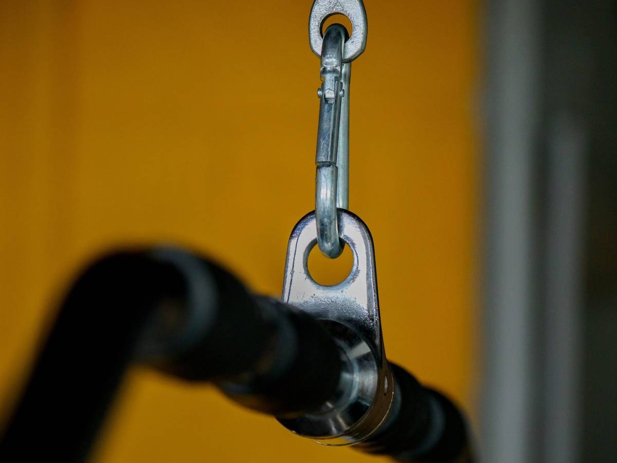 Close-up photo of a climbing piton with a clearly visible eye for attaching a carabiner.